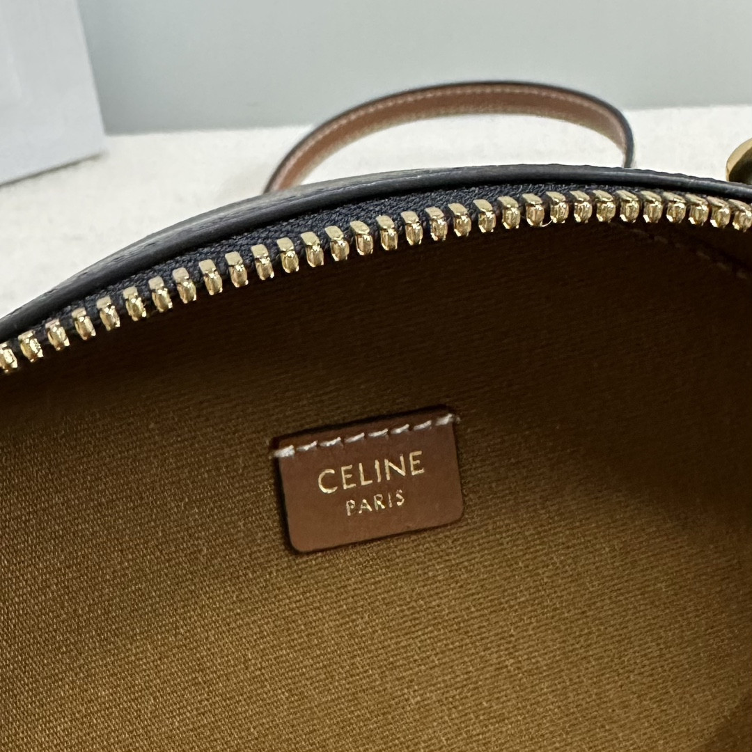 Ce**e half moon case in triomphe canvas and calfskin 17.5x12x6cm