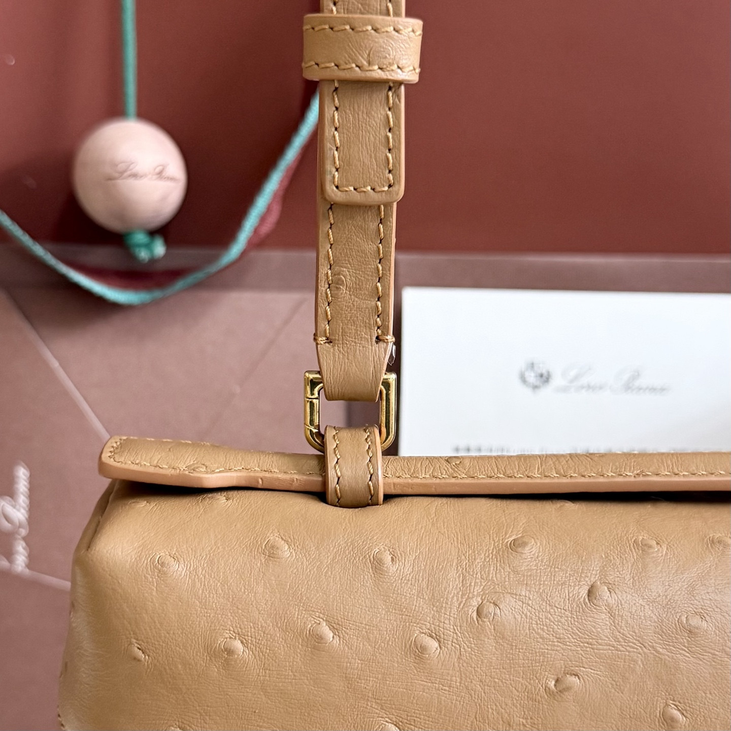 L**o p*ana extra pocket l27 ostrich-grained leather 16x27x10cm